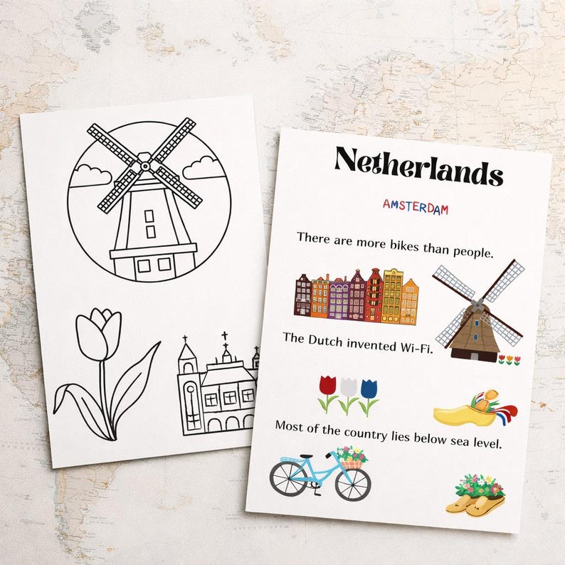 May include: Two white cards with illustrations and text about the Netherlands. One card features a windmill, tulip, and church outline. The other card says "Netherlands" and "Amsterdam" with facts and images of bikes, windmills, and clogs.