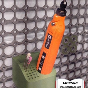 May include: An orange Hardell rotary tool with a brown grinding bit is displayed in a green holder. The holder contains several other bits. The background is a gray honeycomb-patterned structure. The image includes a license notice.