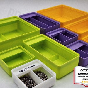 May include: A collection of colorful plastic storage containers in various sizes. The containers are in shades of green, purple, and yellow. One white container is labeled "M2 x 8, 10mm" and contains small metal screws. The image also includes a license graphic.