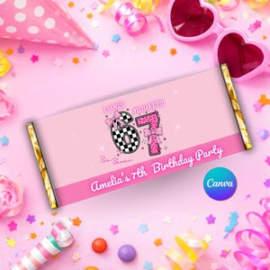 May include: Pink candy bar wrapper with the text "I was now I'm 67" and "Amelia's 7th Birthday Party". The number 6 is checkered and the number 7 has a pink leopard print. Gold foil edges.
