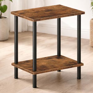 May include: A small, two-tiered side table with a rustic, brown tabletop and a lower shelf. The table has black metal legs and a rectangular shape. The dimensions are approximately 24 inches high, 16 inches wide, and 12 inches deep.