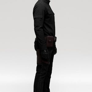 May include: A black outfit consisting of a long-sleeved shirt, pants, gloves, and boots. The outfit includes a brown leather belt with pouches and a holster. The mannequin is wearing a black helmet.