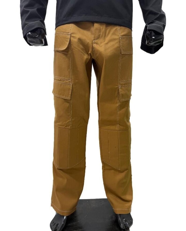 May include: Brown cargo trousers with multiple pockets and white stitching details. The trousers have a classic design with reinforced knees and a straight leg fit. The trousers are made of a durable material.