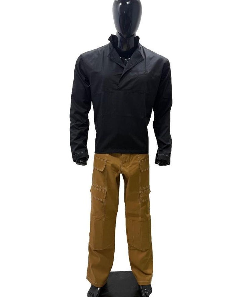 May include: A black long-sleeved shirt with a collar and a front pocket, worn with brown cargo trousers. The trousers feature multiple pockets and light-coloured stitching. The outfit is displayed on a black mannequin.