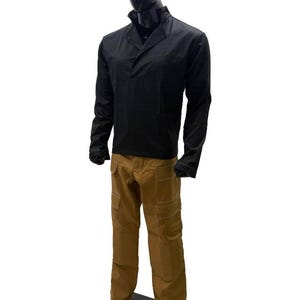 May include: A black long-sleeved shirt with a collared neckline and brown cargo trousers. The trousers have multiple pockets and visible stitching. The outfit is displayed on a mannequin.