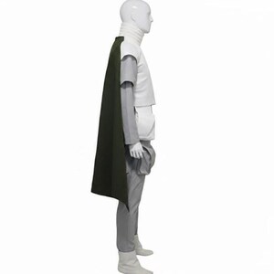 May include: A costume set displayed on a mannequin, featuring a high-neck white vest, light grey long-sleeved shirt, matching grey trousers, and a long dark olive green cape. The outfit includes a white utility pouch attached to the side.