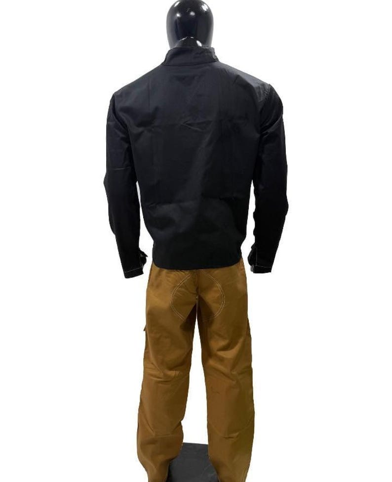 May include: A black jacket and brown trousers outfit on a mannequin. The jacket has long sleeves and a high collar. The trousers are a solid brown colour with visible stitching.