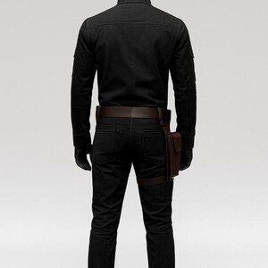 May include: A black outfit consisting of a long-sleeved shirt, pants, and boots. The outfit includes a brown leather belt, a holster, and gloves. The mannequin is wearing a black helmet.
