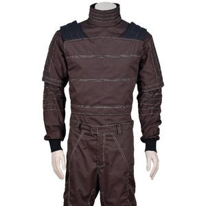 May include: A dark brown long-sleeved jumpsuit featuring a high mock neck collar, black shoulder panels, and prominent white topstitching throughout the garment. The design includes ribbed black cuffs at the wrists and a structured waistline.