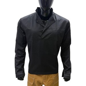 May include: Black long-sleeved shirt with a collared neckline and a button-down design. The shirt is paired with tan cargo trousers. The outfit is displayed on a mannequin.