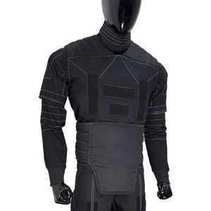 May include: Black tactical suit displayed on a mannequin. The suit features a high collar, long sleeves, and reinforced panels with white stitching. The design includes multiple hook-and-loop fastener patches and a padded lower torso section.