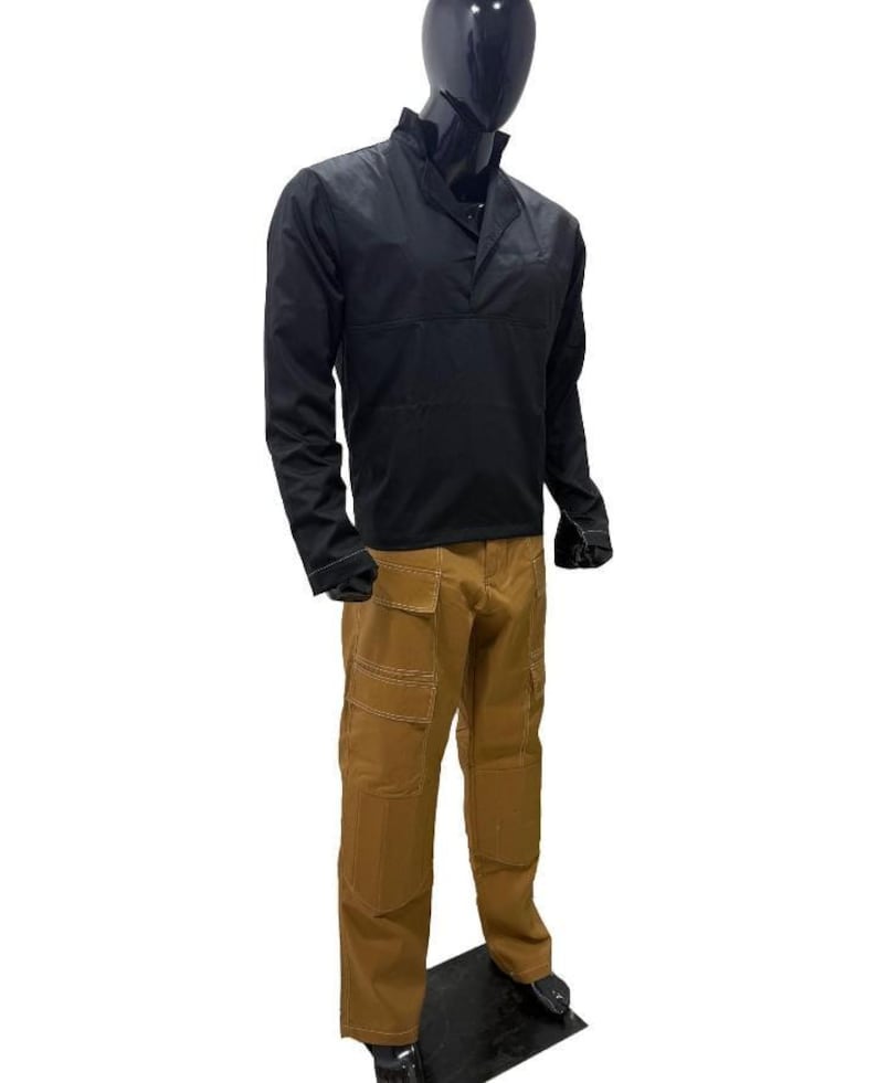 May include: A black long-sleeved shirt with a mandarin collar and brown cargo trousers. The trousers have multiple pockets and white stitching. The outfit is displayed on a mannequin.