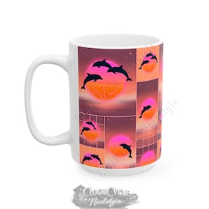 May include: White ceramic mug with a repeating pattern of black dolphin silhouettes, pink and orange geometric suns, and a grid design. The mug has a large handle and the words "Clock Cycle Nostalgia" at the bottom.