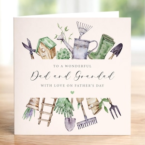 May include: A Father's Day card with watercolor illustrations of gardening tools, including a watering can, boots, and shovel. The text reads "To a Wonderful Dad and Grandad with Love on Father's Day."