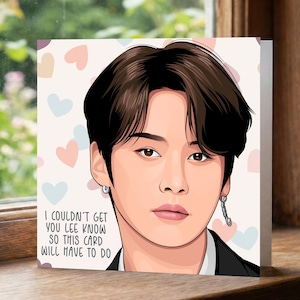 May include: A square greeting card featuring a stylized portrait of a person with dark hair and a black suit. The card has a light background with pastel hearts and the text: "I COULDN'T GET YOU LEE KNOW SO THIS CARD WILL HAVE TO DO."