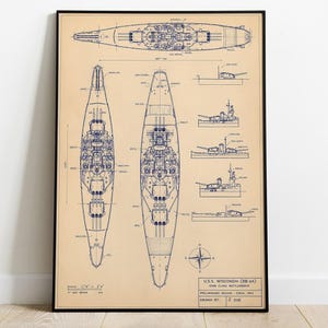May include: Framed blueprint of the U.S.S. Wisconsin (BB-64) Iowa Class Battleship. The print features detailed top and side views, along with smaller diagrams and a compass rose. The blueprint is in blue ink on a tan background.