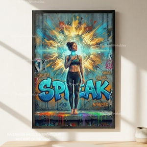 May include: A framed art print featuring a woman standing in front of graffiti that says "Speak". The artwork has a vibrant color palette with blue, yellow, and green hues. The woman is wearing a black sports bra and leggings.