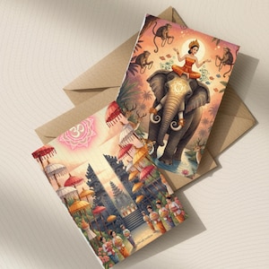 May include: Two rectangular greeting cards featuring vibrant illustrations. One card depicts a person riding an elephant surrounded by monkeys in a jungle. The other card shows a temple scene with colorful umbrellas, figures, and an Om symbol.