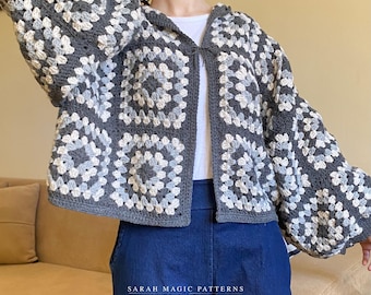 May include: A gray, white, and light blue crochet hooded jacket. The jacket features a granny square pattern and long sleeves. The text "SARAH MAGIC PATTERNS Stitch & Love" is visible at the bottom of the image.