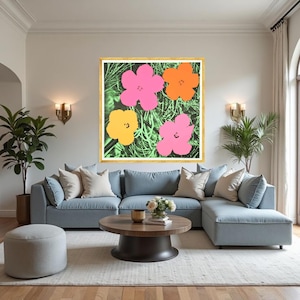 May include: A large framed artwork featuring four stylized flowers in vibrant colors: pink, orange, and yellow, set against a green background. The artwork is displayed above a light blue sectional sofa in a modern living room setting.