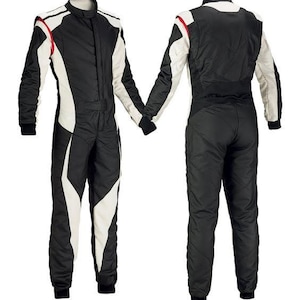 May include: A black and white racing suit with a high collar and long sleeves. The suit features white panels on the sides and sleeves, with red accents. The suit is designed for motorsports and is shown from the front and back.