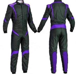 May include: A black racing suit with purple accents. The suit features a zip-up front, long sleeves, and a stand-up collar. Purple stripes and panels are strategically placed on the shoulders, arms, legs, and waist. The suit is designed for motorsports.