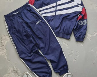Vintage Adidas nylon trainingspakjas en -broek uit de jaren 90, zeldzaam.