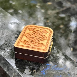 May include: A set of three ceramic mugs with a speckled, matte finish. The mugs are in shades of cream, light gray, and dark gray. Each mug has a simple, minimalist design, perfect for coffee or tea.