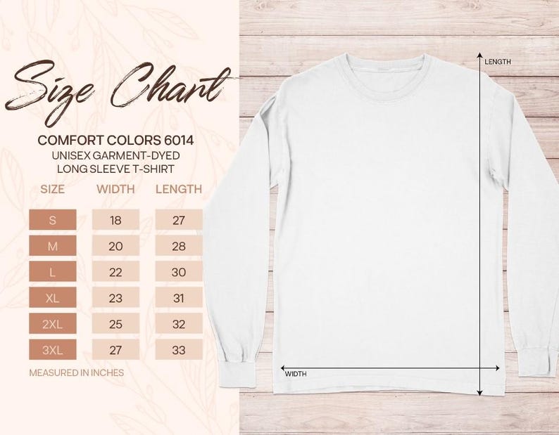 Op de afbeelding: Een wit t-shirt met lange mouwen naast een maattabel voor Comfort Colors 6014. De tabel toont de maten S tot 3XL met bijbehorende breedte- en lengtematen in inches, aangegeven met pijlen op de afbeelding van het t-shirt.