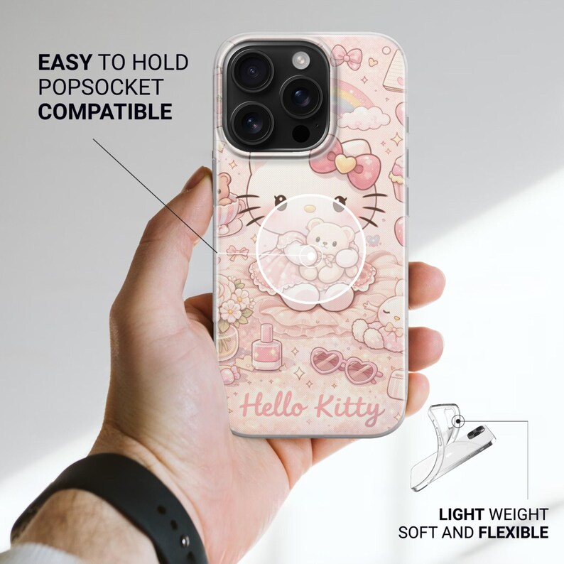 May include: A clear phone case with a pink Hello Kitty design and a popsocket. The case features a repeating pattern of Hello Kitty, bows, and other cute elements. Text on the case reads "Hello Kitty", "Easy to hold Popsocket compatible", and "Light weight soft and flexible".