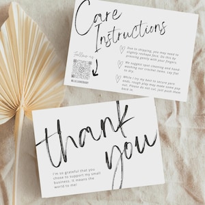 May include: Two white cards with black text. One card reads "Care Instructions" and includes care tips for crochet items. The other card says "thank you" with a message about supporting a small business. A dried plant is in the background.