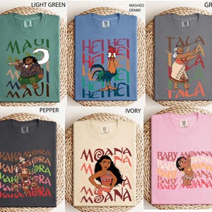 May include: Six t-shirts in various colors, each featuring a graphic from the animated film Moana. Designs include characters like Maui, Hei Hei, and Moana, with text overlays. Colors range from light green to pink.