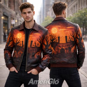 May include: A brown leather jacket with a spooky graveyard scene painted on the front and back. The jacket features a full moon, bare trees, and tombstones. The jacket has a brown collar and cuffs, and silver studs on the shoulders.