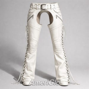 May include: White leather chaps with a belt, zippers, and lace-up detailing. The chaps have a unique design with an open back. The text "AmeriGlo" is visible at the bottom.
