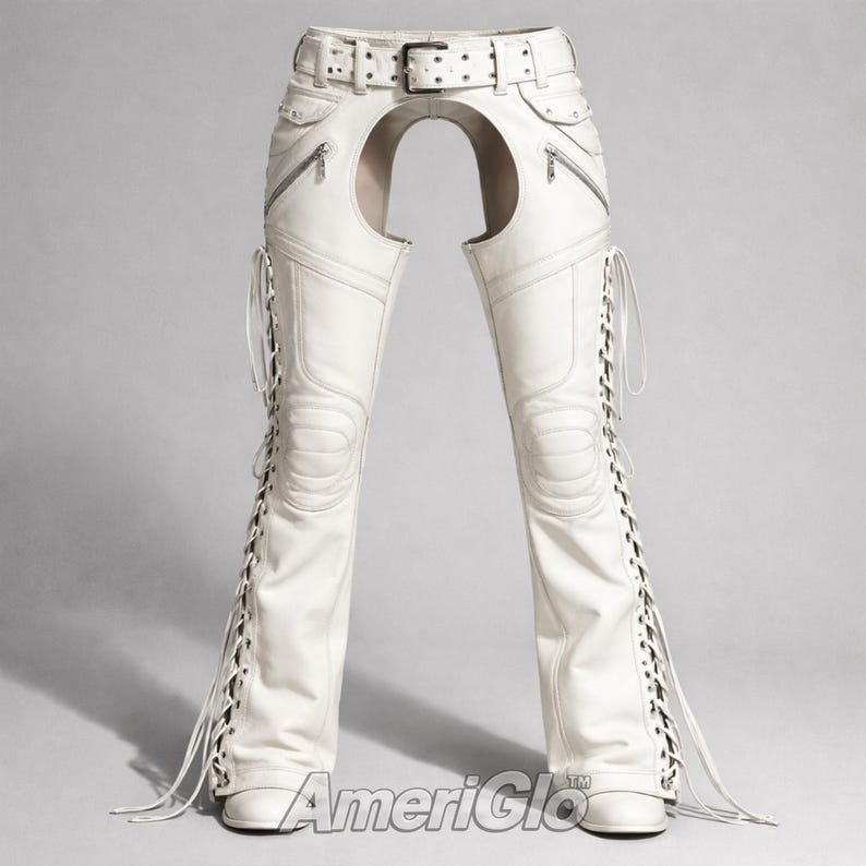 May include: White leather chaps with a belt, zippers, and lace-up detailing. The chaps have a unique design with an open back. The text "AmeriGlo" is visible at the bottom.