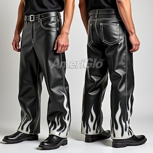 May include: Black leather trousers featuring a white flame design on the lower legs. The trousers have a straight leg cut, white stitching, and a belt with a silver buckle. The trousers are shown from the front and back.