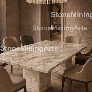 May include: A dining room set featuring a large rectangular marble table with a light brown and cream veined pattern. The table is surrounded by several upholstered chairs. A large, circular chandelier hangs above the table. The text "StoneMiningArts" is visible.