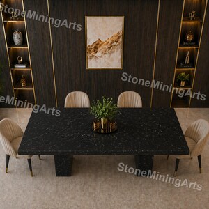 May include: A modern dining room set featuring a large black rectangular table with a marble-like pattern, supported by two central pillars. Four beige upholstered chairs surround the table. The room has dark wood paneling with gold accents and built-in shelves.