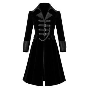May include: A long, black velvet coat with a leather collar and cuffs. The coat features a series of buckles and a decorative chain down the front. The design is reminiscent of Victorian-era fashion.