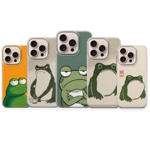 May include: A collection of phone cases featuring frog illustrations in various poses and colors. The cases showcase a range of designs, including a green frog with crossed arms and a frog with a cup. The cases are in shades of orange, green, and beige.