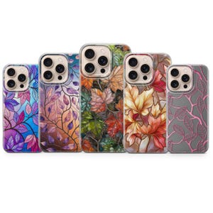 May include: Five phone cases with colorful leaf designs. The cases feature a variety of colors, including blue, purple, orange, green, and red. Each case has a different leaf pattern, creating a unique and artistic look.