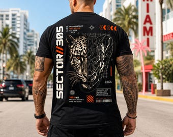 May include: Black t-shirt with a graphic of a leopard's face, half natural and half mechanical. The shirt has the text "SECTOR//305" and "MIAMI DISTRICT" printed on it. The shirt is worn by a person.
