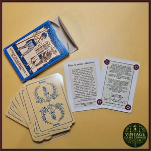 May include: A deck of playing cards titled Prise de la Bastille 14 Juillet 1789 with a blue box featuring historical illustrations. The set includes a collection list card and an informational card with English, German, and Japanese text.