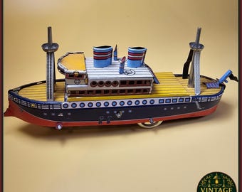 Nave giocattolo vintage in latta a carica manuale – Transatlantico in metallo litografato