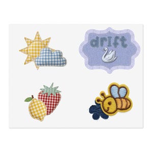 May include: A set of four fabric patches featuring a yellow gingham sun with a blue gingham cloud, a purple scalloped patch with the text drift and a white swan, a yellow gingham lemon with a red gingham strawberry, and a yellow and blue bee.