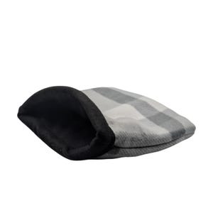 May include: A gray and white plaid flat cap with a black interior. The cap is made of a soft material and is designed in a classic style. The hat is a traditional accessory.