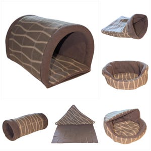 May include: A selection of small pet beds and tunnels. The items are made of grey fleece with a white wavy stripe pattern. The collection includes a tunnel, a bed with a hood, a bed, and a triangular hideaway.