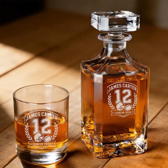 A football-shaped whiskey decanter with custom engraving — the kind of barware gift that actually earns a permanent spot on the liquor cabinet shelf.