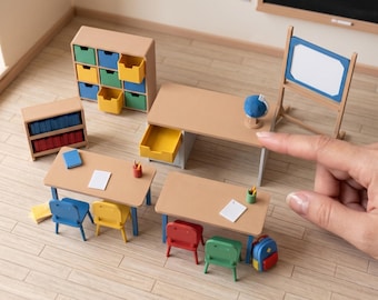 May include: Miniature classroom furniture set including desks, chairs, a storage unit with colorful drawers, a bookshelf with books, a whiteboard, a globe, and a backpack. Text reads: DIGITAL STL FILES - NO PHYSICAL ITEM and INSTANT DOWNLOAD.