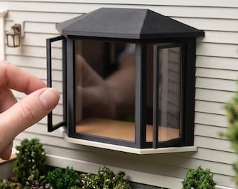 May include: A black miniature bay window model with a peaked roof and open side panels, mounted on a light-colored siding wall. The text at the top reads DIGITAL STL FILES - NO PHYSICAL ITEM and at the bottom INSTANT DOWNLOAD.